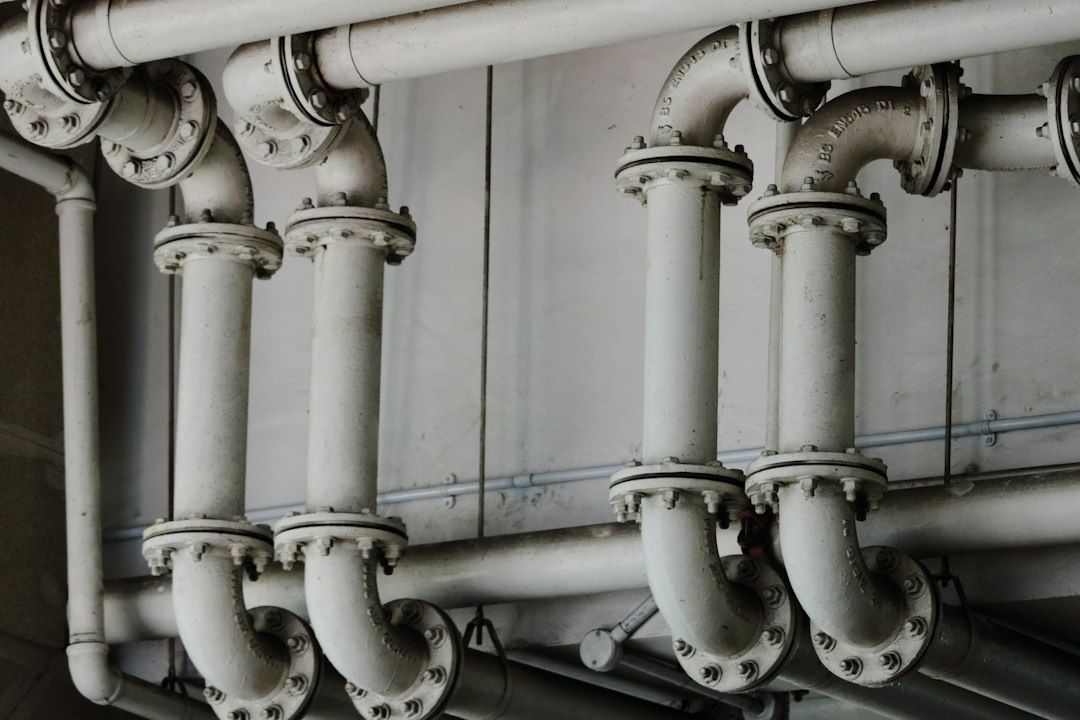 Flanged white pipes forming an industrial cooling network